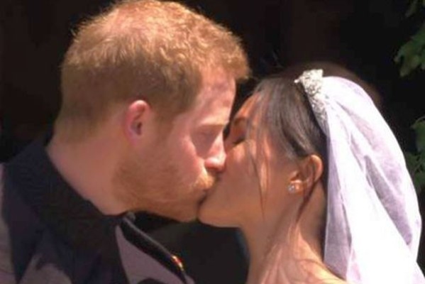 Prince Harry and Meghan kiss