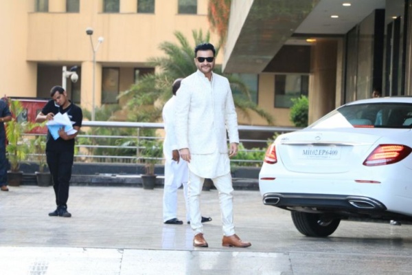 Sanjay Kapoor added black wayfarers to his dapper look in white.