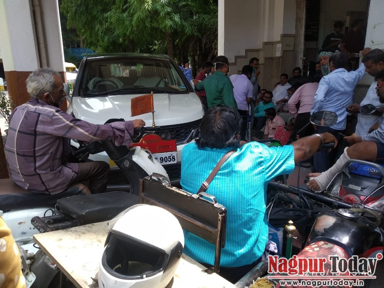 Physically challenged people throng NMC office, block Mayor's car over demolition of their shops - Vimarsana News
