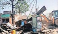 NIT runs bulldozer on encroachers in North Nagpur