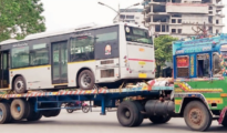 Curious: E-bus arrives in Nagpur riding atop trailer truck to join Aapli Bus fleet