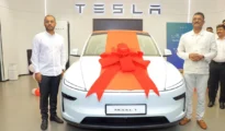 Maharashtra minister receives 1st car delivery from Tesla showroom in Mumbai