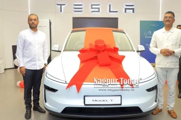 Maharashtra minister receives 1st car delivery from Tesla showroom in Mumbai
